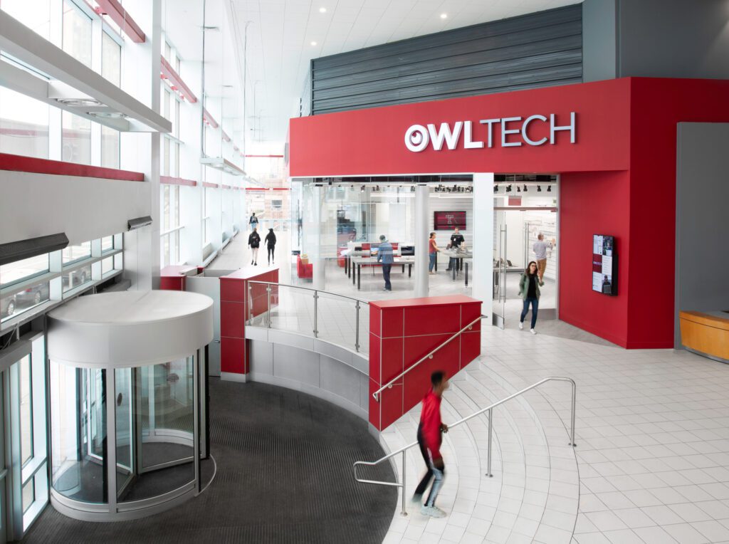 Temple university lobby with OWL tech store with people shopping and walking around