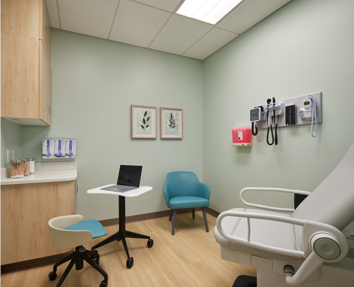 Sage Health exam room with medical equipment and laptop