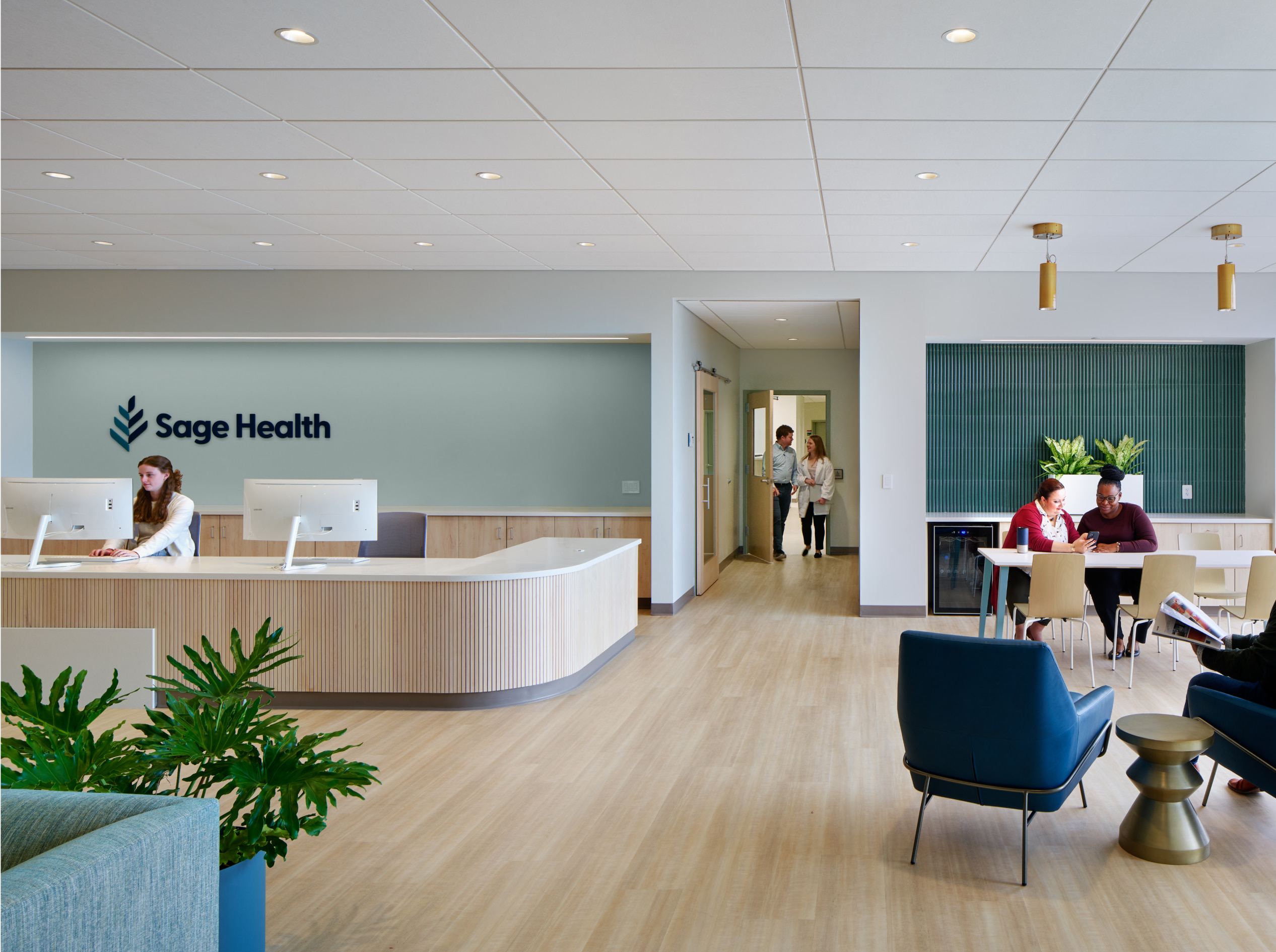 Sage Health Reception with people and a receptionist working