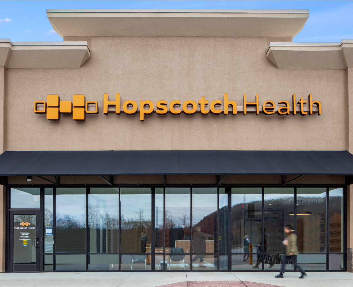 Hopscotch Health entrance with a person passing by