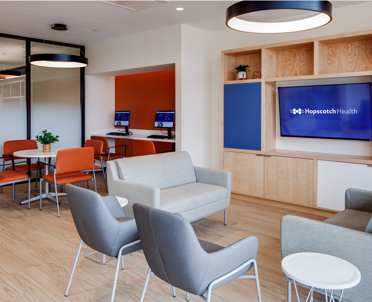 Hopscotch Health waiting room with chairs and tables