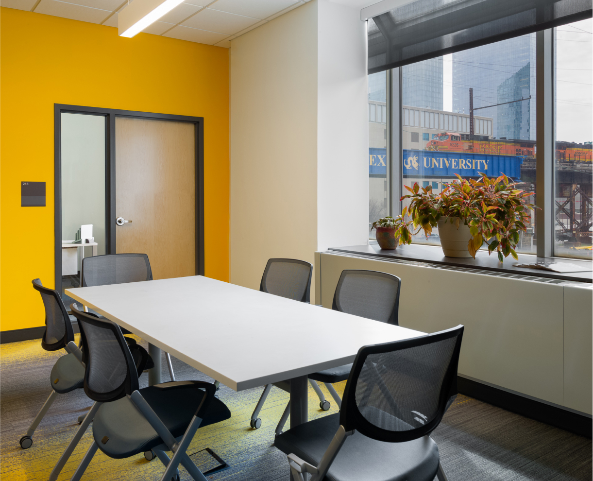 Conference room with a desk and chairs