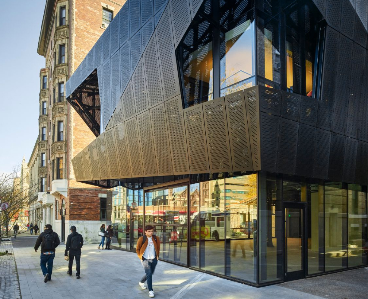 Hamilton court in a close view where people are passing by in front of the building