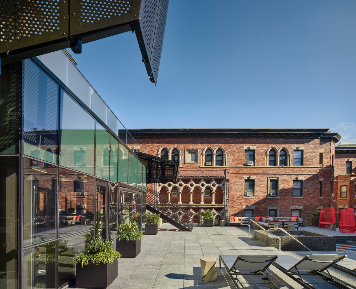 Hamilton Court Roof with the sun-beds and stairs to the upper floor