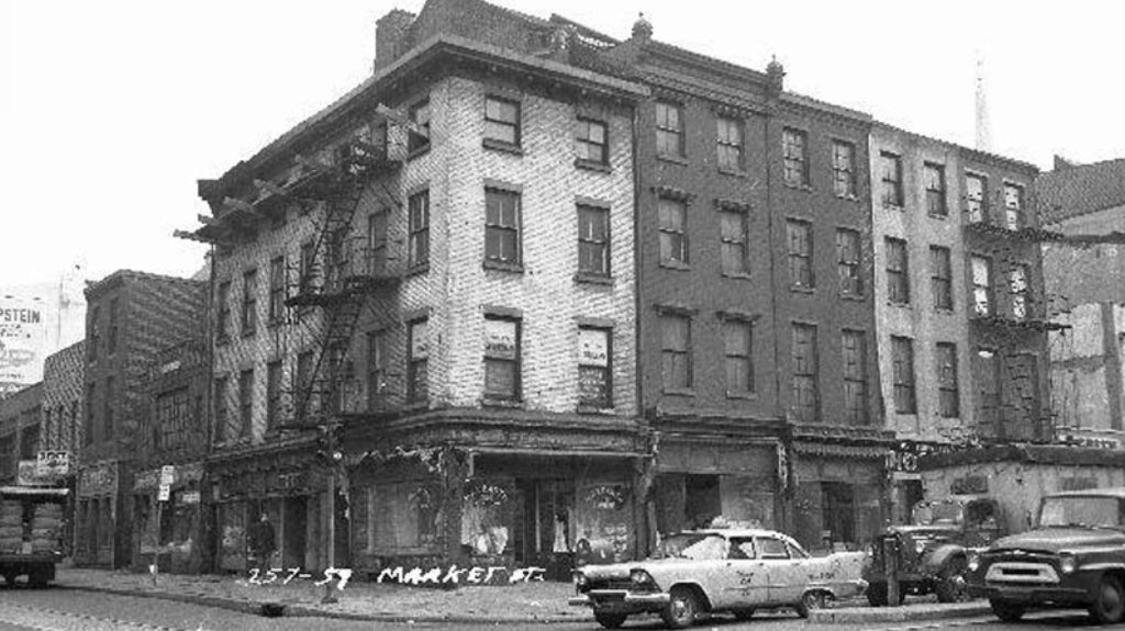 Black and white image of an old building at the corner