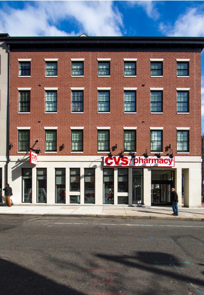 A building exterior with CVS pharmacy on the first floor