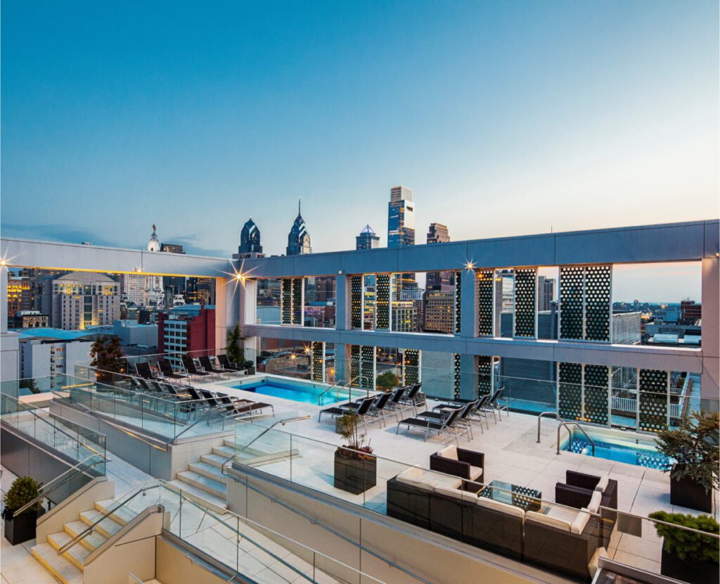 Goldtex Apartments rooftop with swimming pools and sitting area