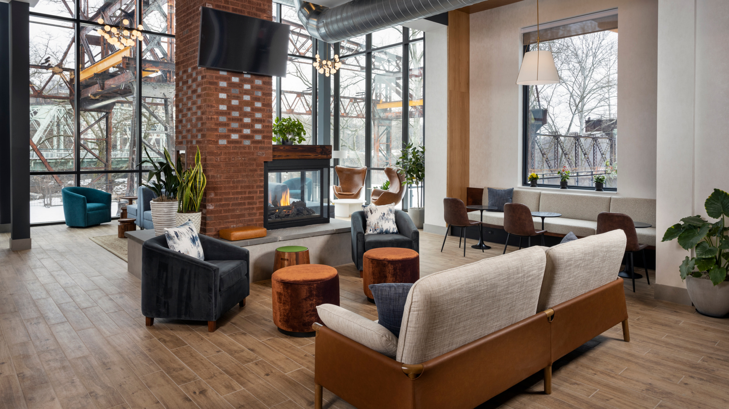 Pencoyd lobby with sofa, chairs, tables and fireplace