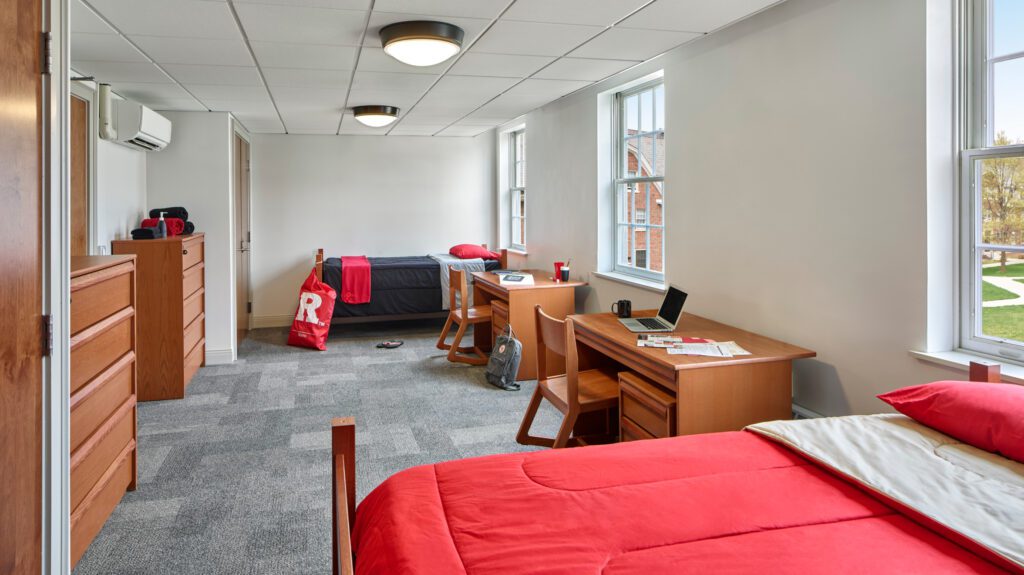 Rutgers Uni dorm room with red/wood-colored interior