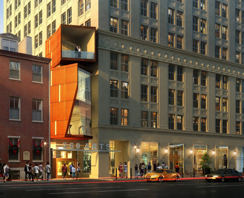 260 South Broad Street exterior with people walking by and two people standing at a balcony of the building