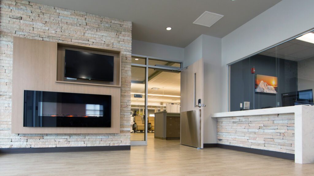 Dialysis Clinics front desk area with a fireplace