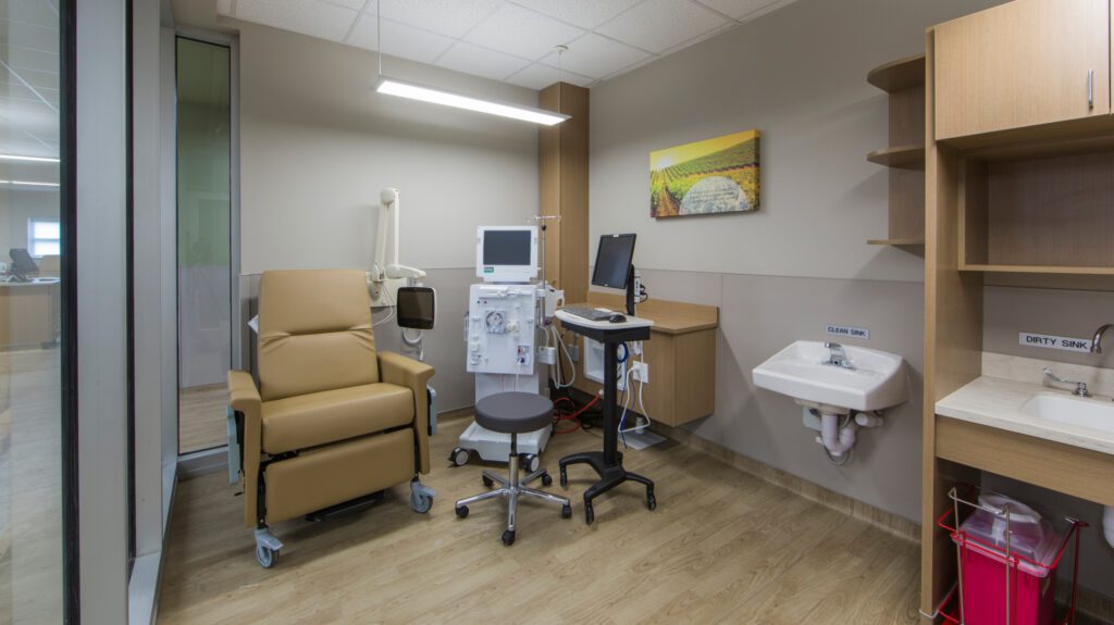 Dialysis Clinics exam room with equipment, sinks, and a chair