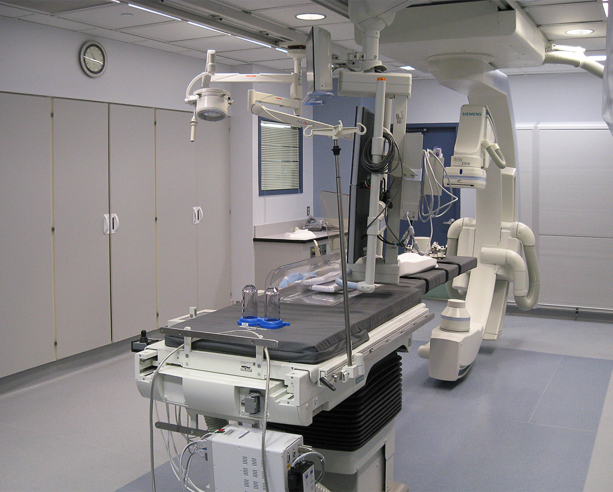 catheter lab, including a patient table and other associated equipment