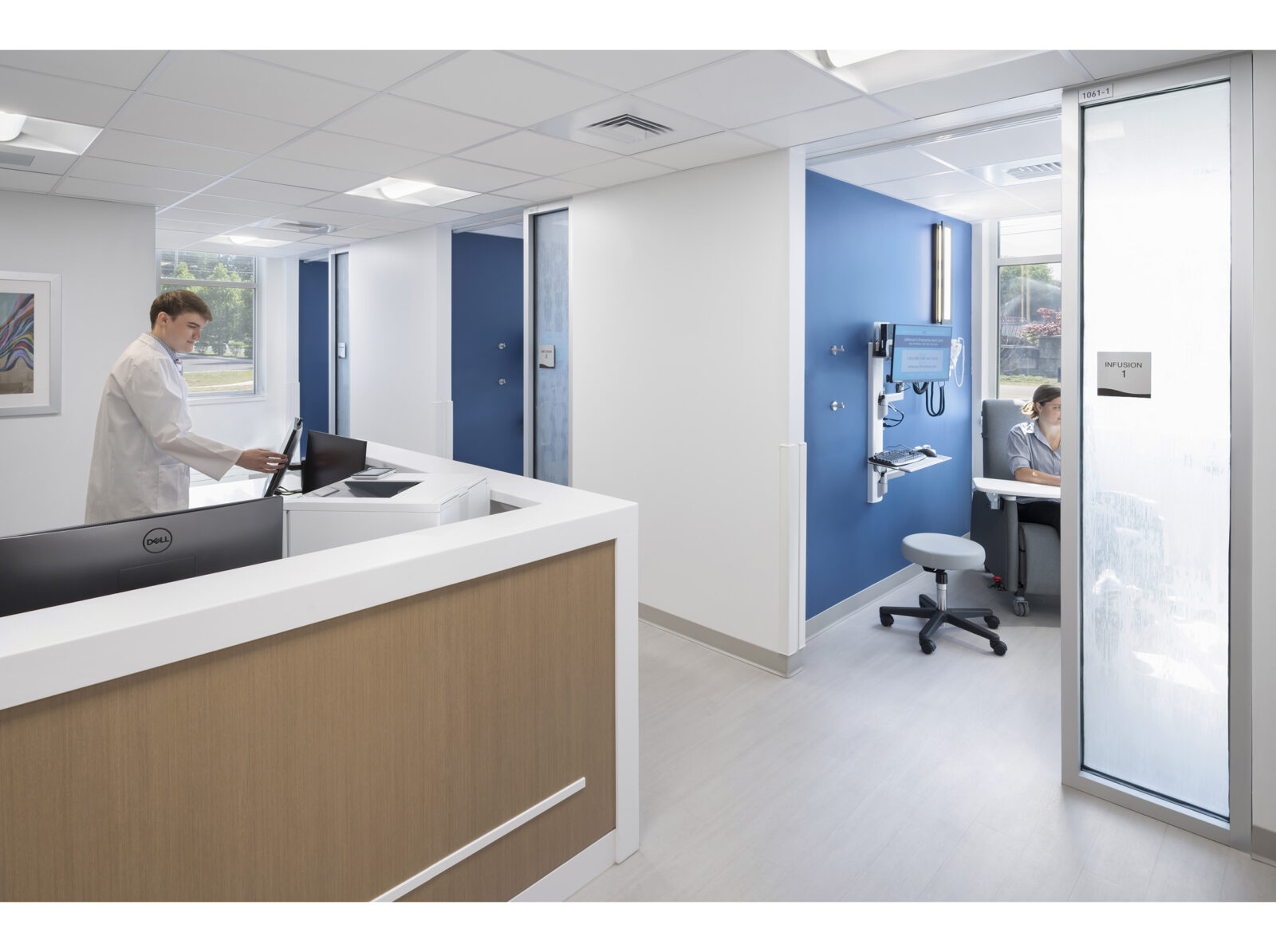 photo of the infusion room area of the clinic. exam rooms are spacious with frosted glass windows